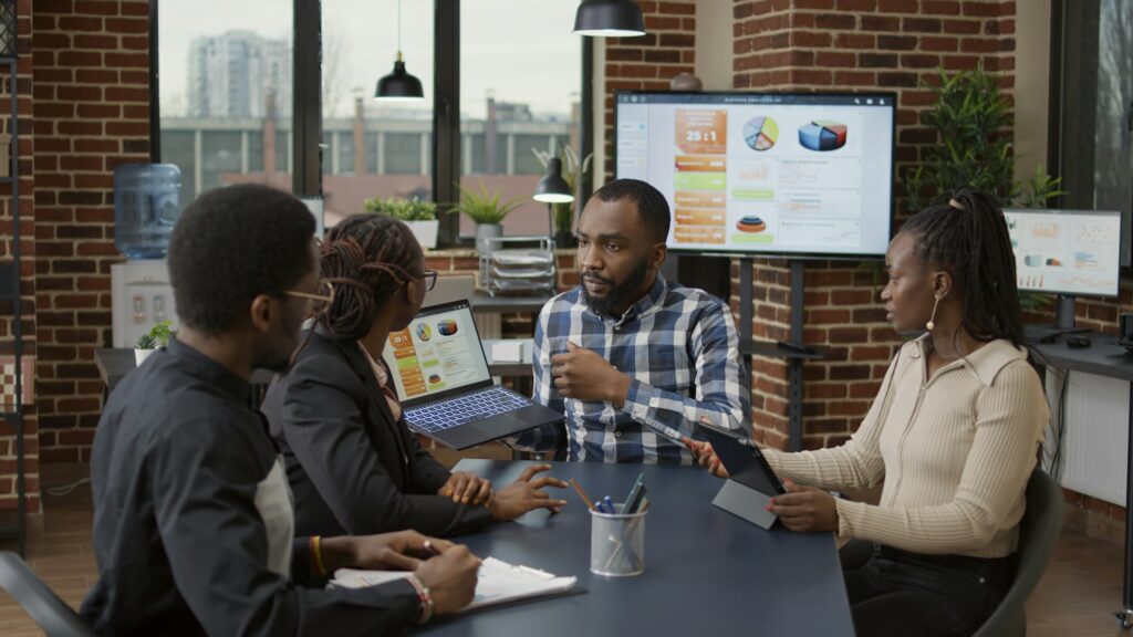 Team of african american people meeting in office to plan business strategy